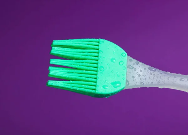 Silicone Kitchen Brush Cooking Drops Water Purple Background — Stock Photo, Image