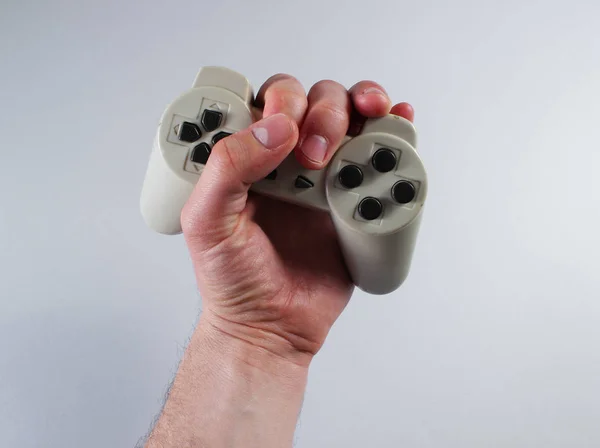 Male Hand Holding Gamepad Gray Background — Stock Photo, Image