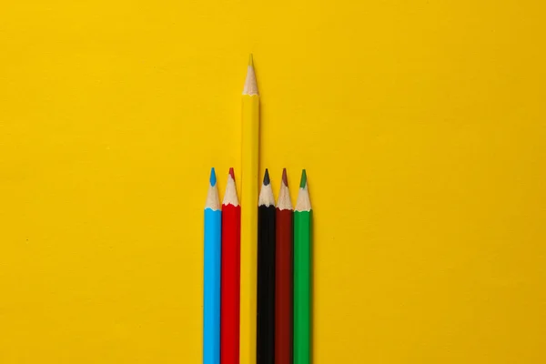 Set Colored Pencils Yellow Background Uniqueness Concept Top View — Stock Photo, Image