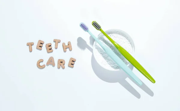 Two Toothbrushes Tooth Powder White Background Slogan Teeth Care Minimalism — Stock Photo, Image