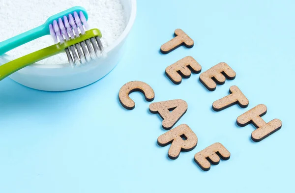 Two Toothbrushes Tooth Powder Blue Background Slogan Teeth Care Minimalism — Stock Photo, Image