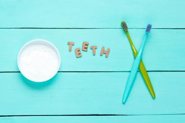 Two Toothbrushes Tooth Powder Blue Wooden Background Word Teeth Minimalism — Stock Photo, Image