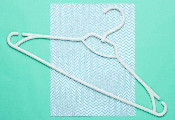 White Plastic Hanger Blue Background Top View — 스톡 사진
