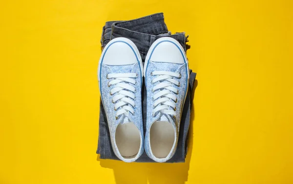 Minimalism Fashion Concept Fashionable Sneakers Jeans Yellow Background Top View — 스톡 사진