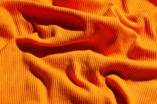 Фон Смятой Оранжевой Ткани Крупным Планом — стоковое фото