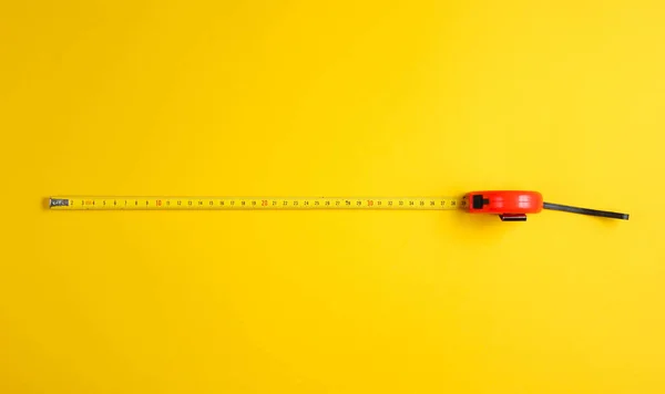 Tape Measure Yellow Background Top View Minimalistic Industrial Concept — Stock Photo, Image