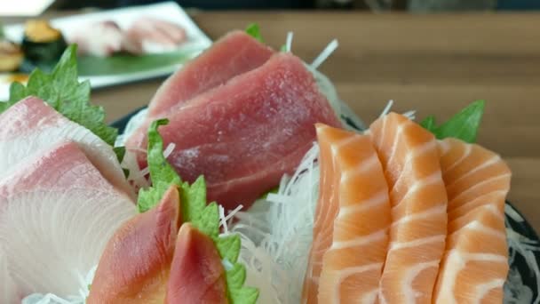 Pieces of seafood on ice in bowl — Stock Video