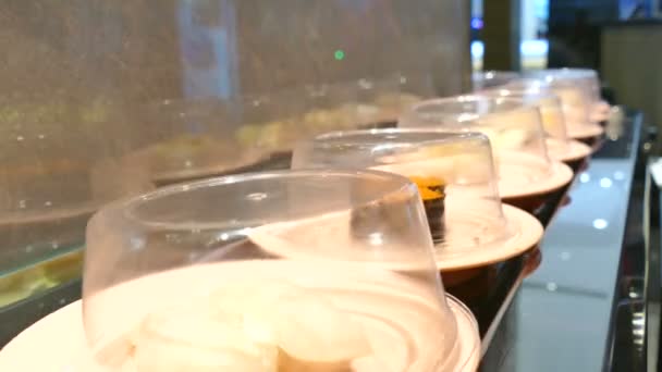 Sushi moving on conveyor belt — Stock Video