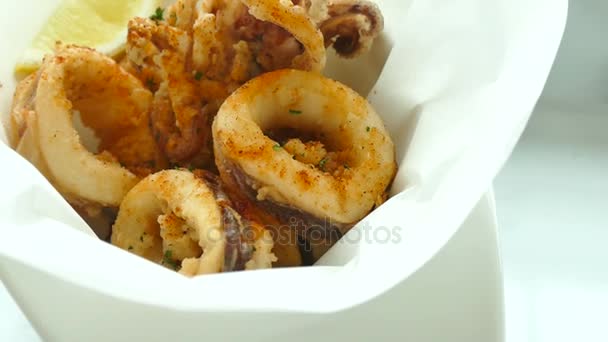 Calamari rings with lemon — Stock Video