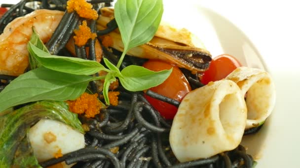 Delicious black pasta with seafood — Stock Video