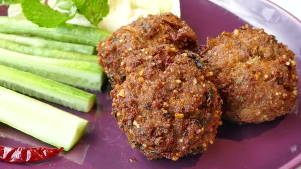 Meat balls with cucumbers and green — Stock Video