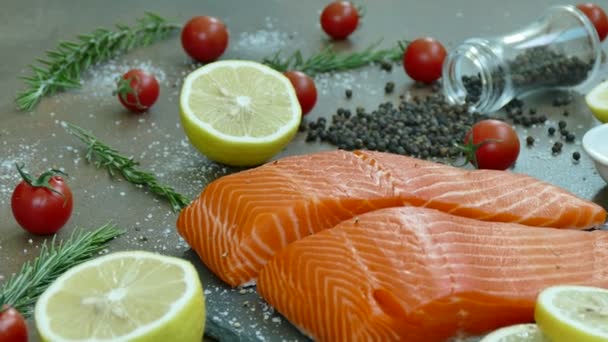 Fresh raw salmon fillet with ingredients for cooking — Stock Footage Fresh Raw Salmon Fillet Ingredients Cooking Video Clip
