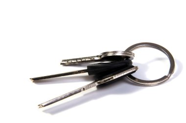 details of key ring with various door and car keys against a white background clipart
