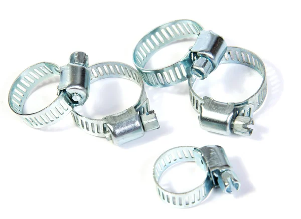 Entire frame filled with gear clamps or hose clamps. Good plumbing or hardware theme — Stock Photo, Image