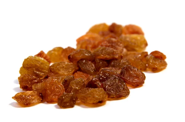 Gele sultanas rozijnen geïsoleerd op witte achtergrond cutout — Stockfoto