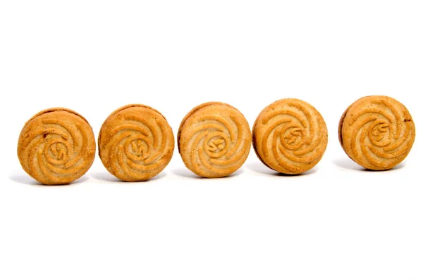 Galletas de pastelería cortas apiladas aisladas en blanco — Foto de Stock