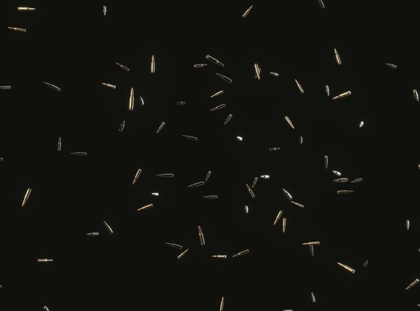Floating Rifle Bullets on Black Background