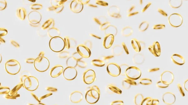 Anéis de casamento de ouro quente flutuando em branco um vazio de luz — Fotografia de Stock