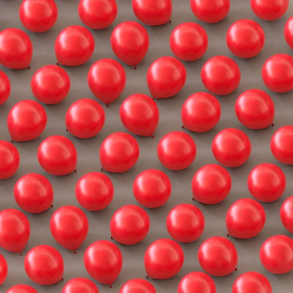 Globos rojos isométricos en una cuadrícula apretada sobre una superficie de concreto simple — Foto de Stock