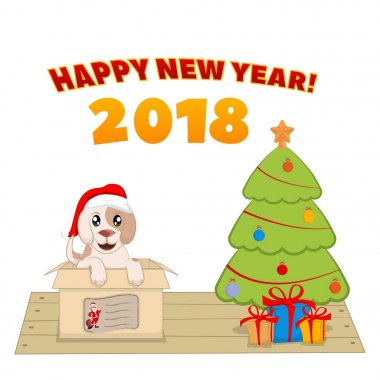 Bir Noel ağacı yakınındaki bir kutu içinde köpek yavrusu.