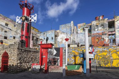 Havana, Cuba-December 20, 2019: Colourful Callejon de Hamel with art installations, murals, and performances celebrating Afro-Cuban culture. An alternative place with artwork and decorated with sculpt clipart