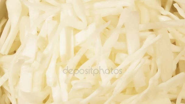 Chopped cabbage in white cup on wooden background close up. Ingredient for vegetable salad — Stock Video