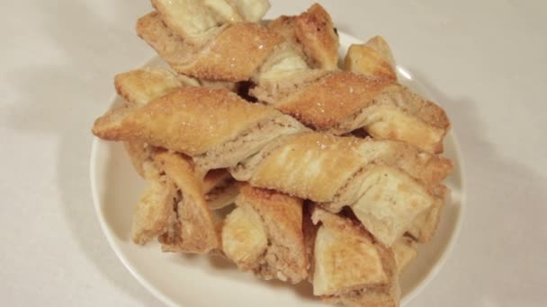 Delicious puff cookie rotate on the background of flowers — Stock Video