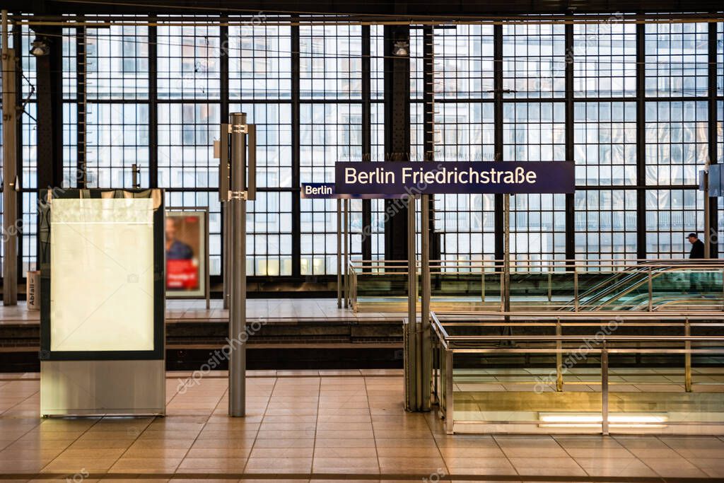 Berlin Friedrichstrasse station sign at train station in Berlin, Germany.