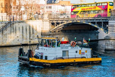 Berlin, Germany - December, 2019: Working boat on Spree river in Berlin.