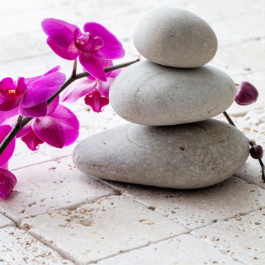 wellbeing, meditation and femininity with stack of balancing pebbles