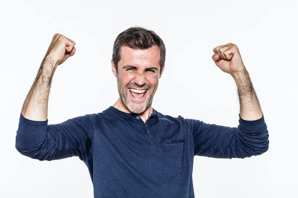 Excited young man laughing and shouting for success and satisfaction — Stockfoto