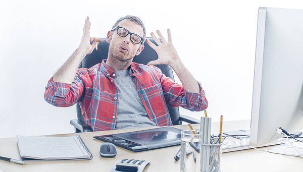 exhausted casual man with eyeglasses being sick of working