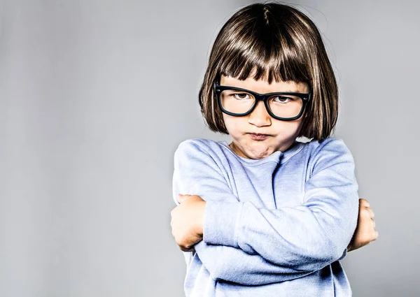 Kid body language with sulking, pouting small child crossing arms — Stock Photo, Image