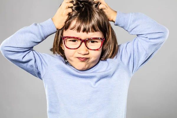 Annoyed child scratching head for small tantrum or itchy allergies — Stock Photo, Image