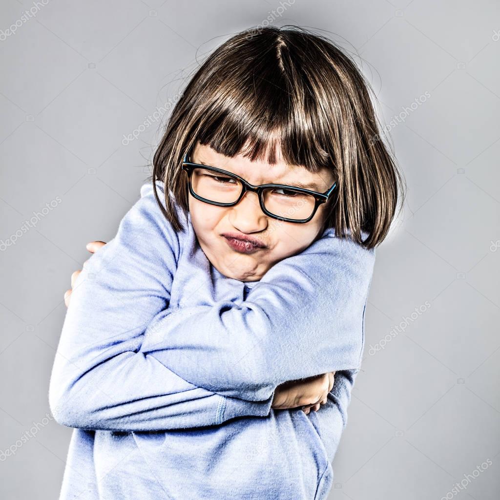 pouting girl having mad tantrum, crossing her arms for disagreement