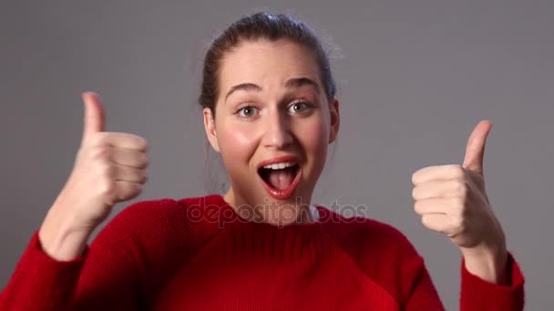 Happy teenager laughing with thumbs up expressing her joyful excitement — Stock Video