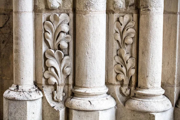 Antique building's detail of white limestone pillars or columns — Stock Photo, Image