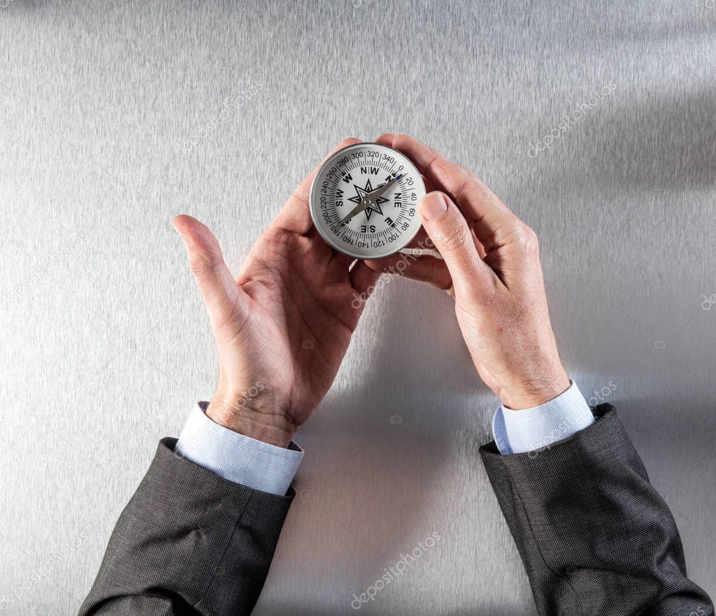 concept of career exploration for businessman hands holding a compass