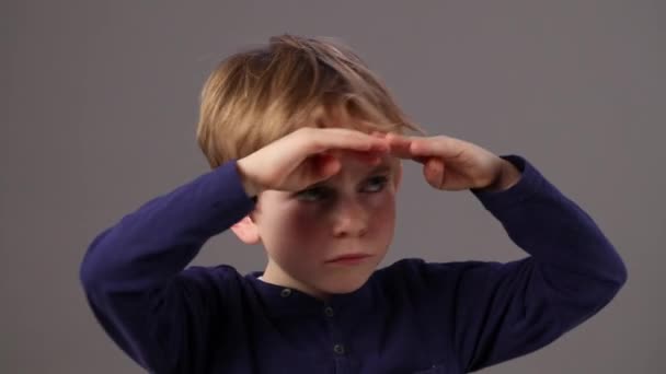 Unhappy beautiful young boy frowning in looking away or ahead — Stock Video