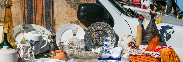 decorative display of household objects and dishes at boot sale