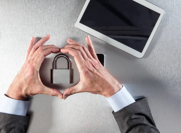 businessman hands showing core symbol of professional security, data faith