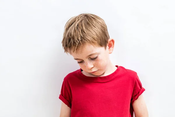 Disappointed child looking down expressing solitude, disillusion or parent problems — Stock Photo, Image