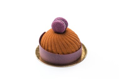 Bir girdap kek serpilir çikolata ve karamel ile macaroons