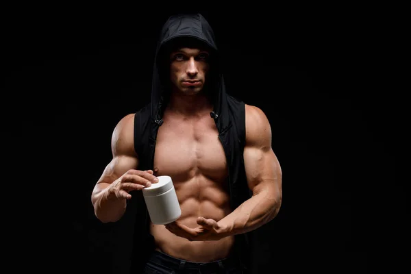 Muscular Culturista Con Tarro Proteína Sobre Fondo Oscuro Nutrición Deportiva —  Fotos de Stock