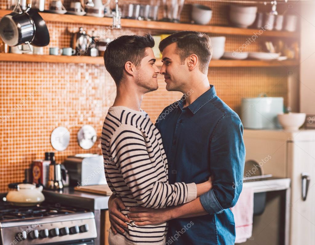 Homosexual Couple Cooking Food In Kitchen High Resolution Stock Photography And Images