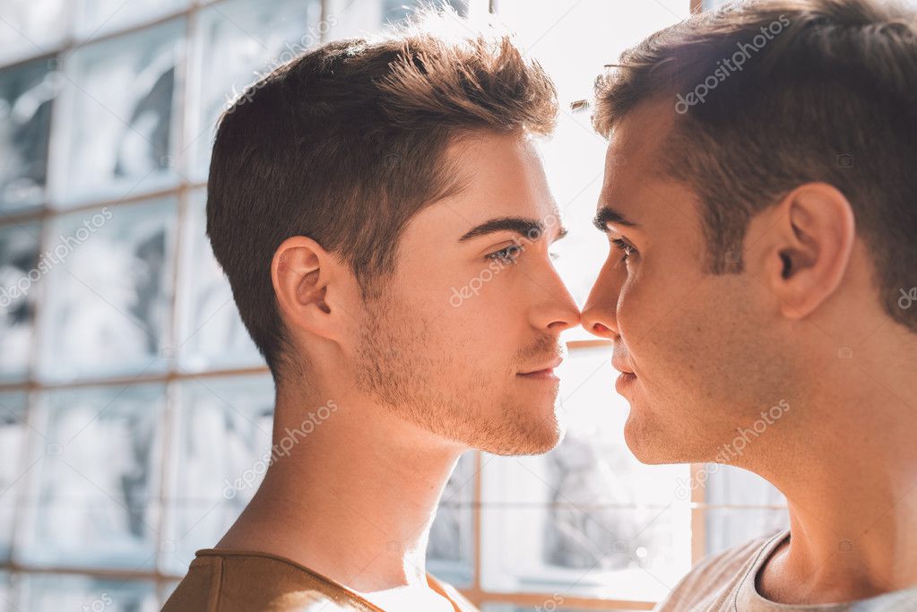 gay couple looking into each other