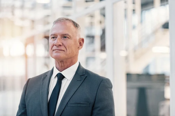 Businessman in suit looking pensive — Stock Photo, Image