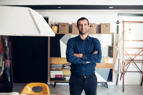 Confident businessman standing in studio — Stock Photo, Image