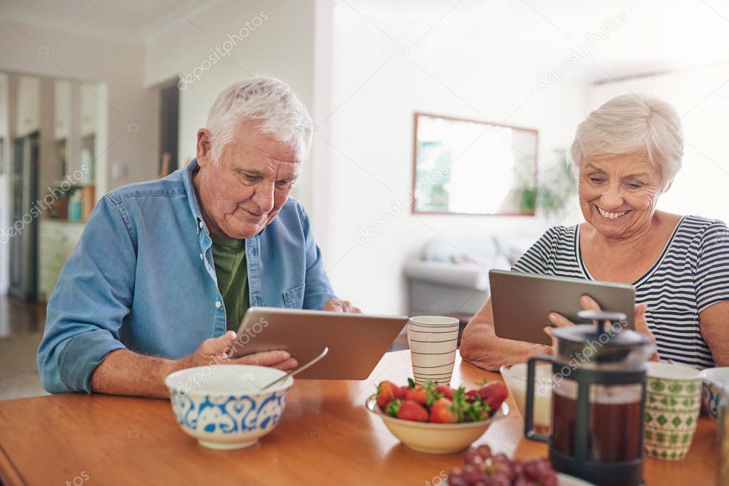 couple using digital tablets