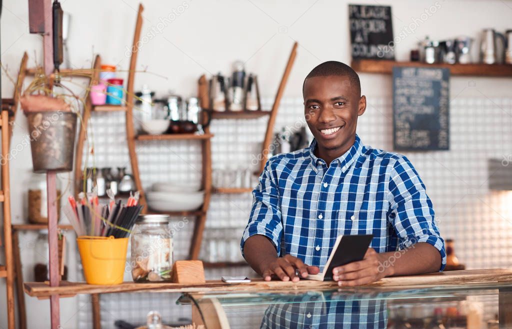 entrepreneur writing notes in book